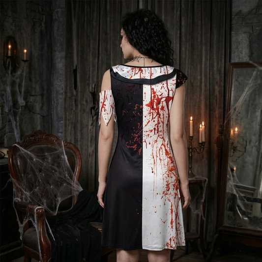 Woman in a black and white dress with red stains in a dark, eerie room.