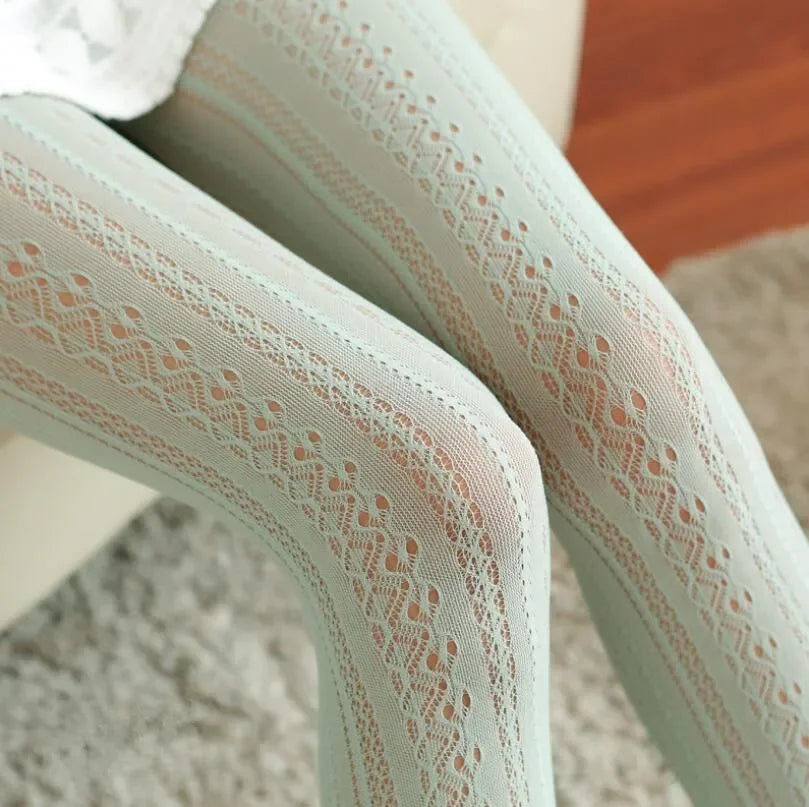 Close-up of sheer lace tights on a blurred background
